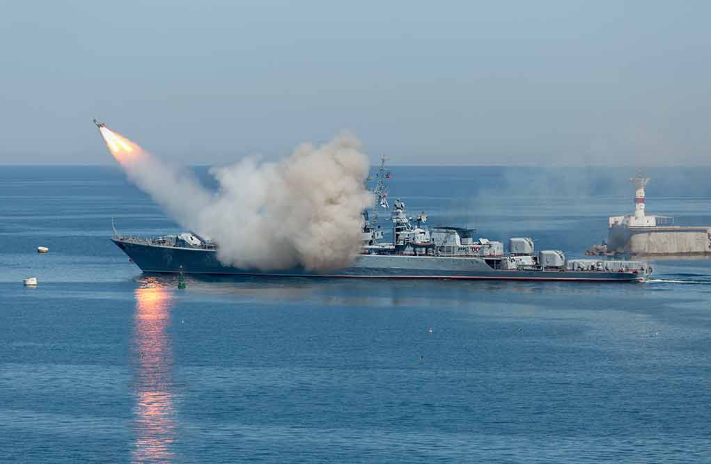 Warship launching a missile at sea