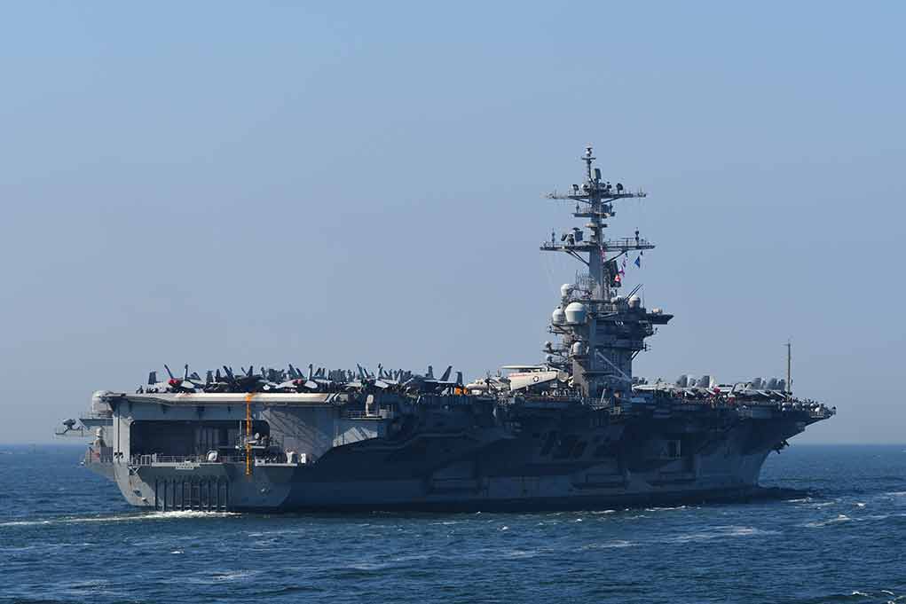 Aircraft carrier cruising at sea