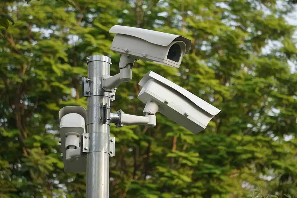 surveillance cameras mounted on a metal pole