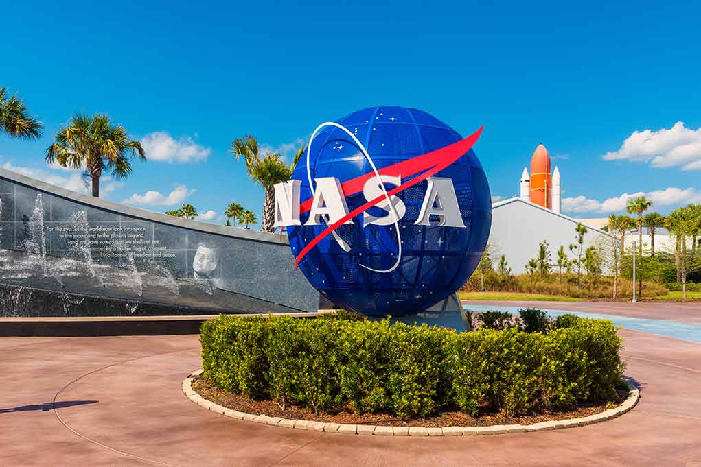 NASA globe sign at visitor complex entrance